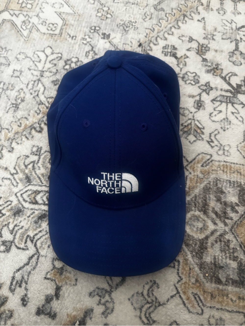 The North Face Royal Blue Hat with White Logo Tag
